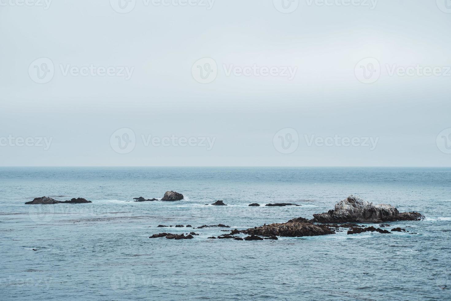 rocks in ocean bay photo