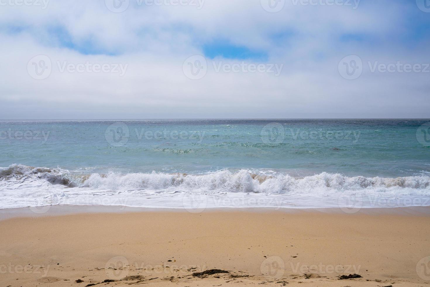 Sandy beach and ocean background photo