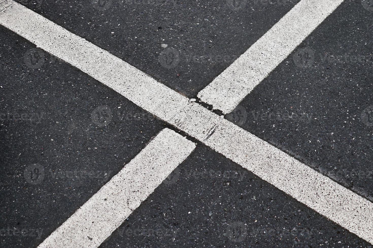 Detailed view on asphalt surfaces of different streets and roads with cracks photo