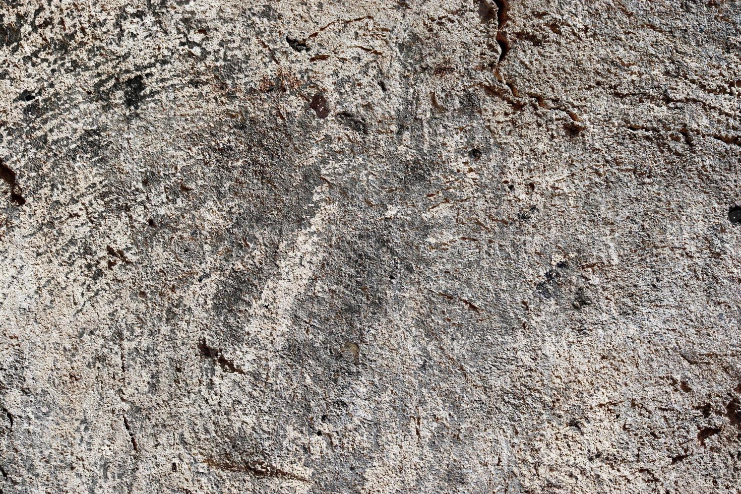 Detailed view on aged concrete walls with cracks and a lot of structure in high resolution photo