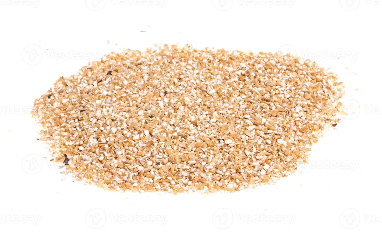 Pearl barley heap isolated on white photo