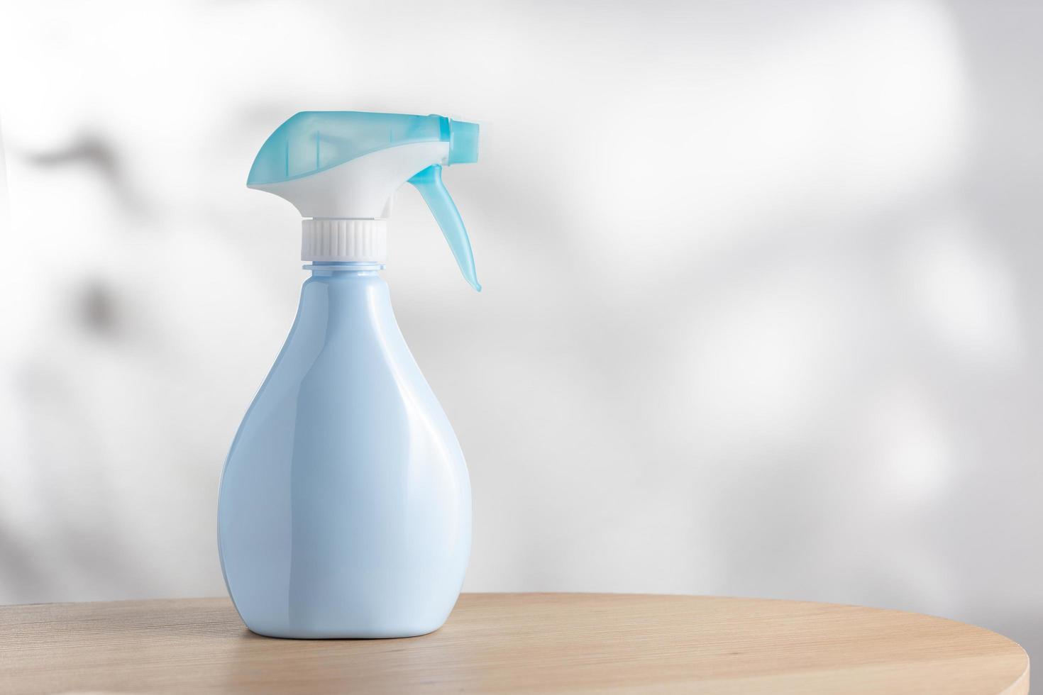 Blue air freshener spray bottle. photo