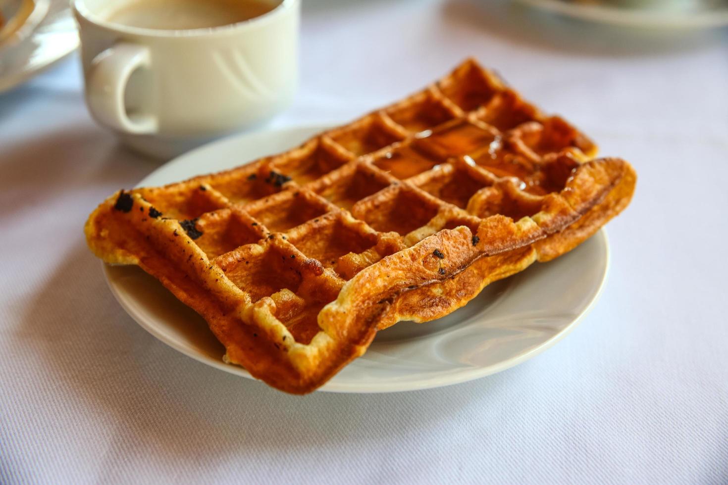 Belgian waffle on the plate and white background photo