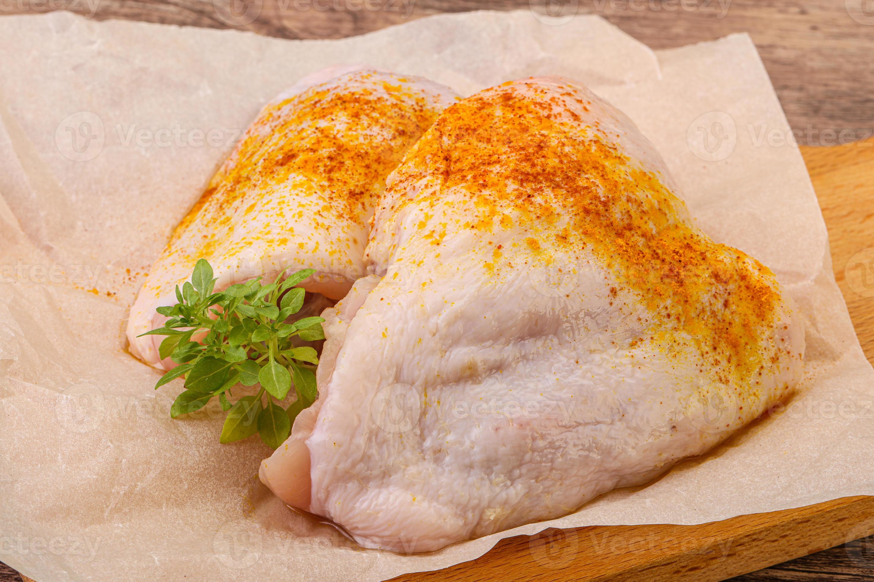 Raw chicken thigh with spices 12269978 Stock Photo at Vecteezy