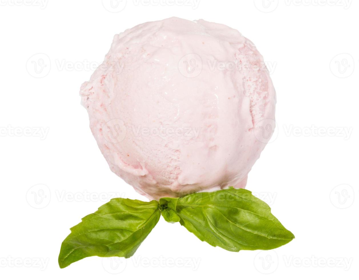 Scoop of strawberry ice cream from top on white background with mint leaf photo