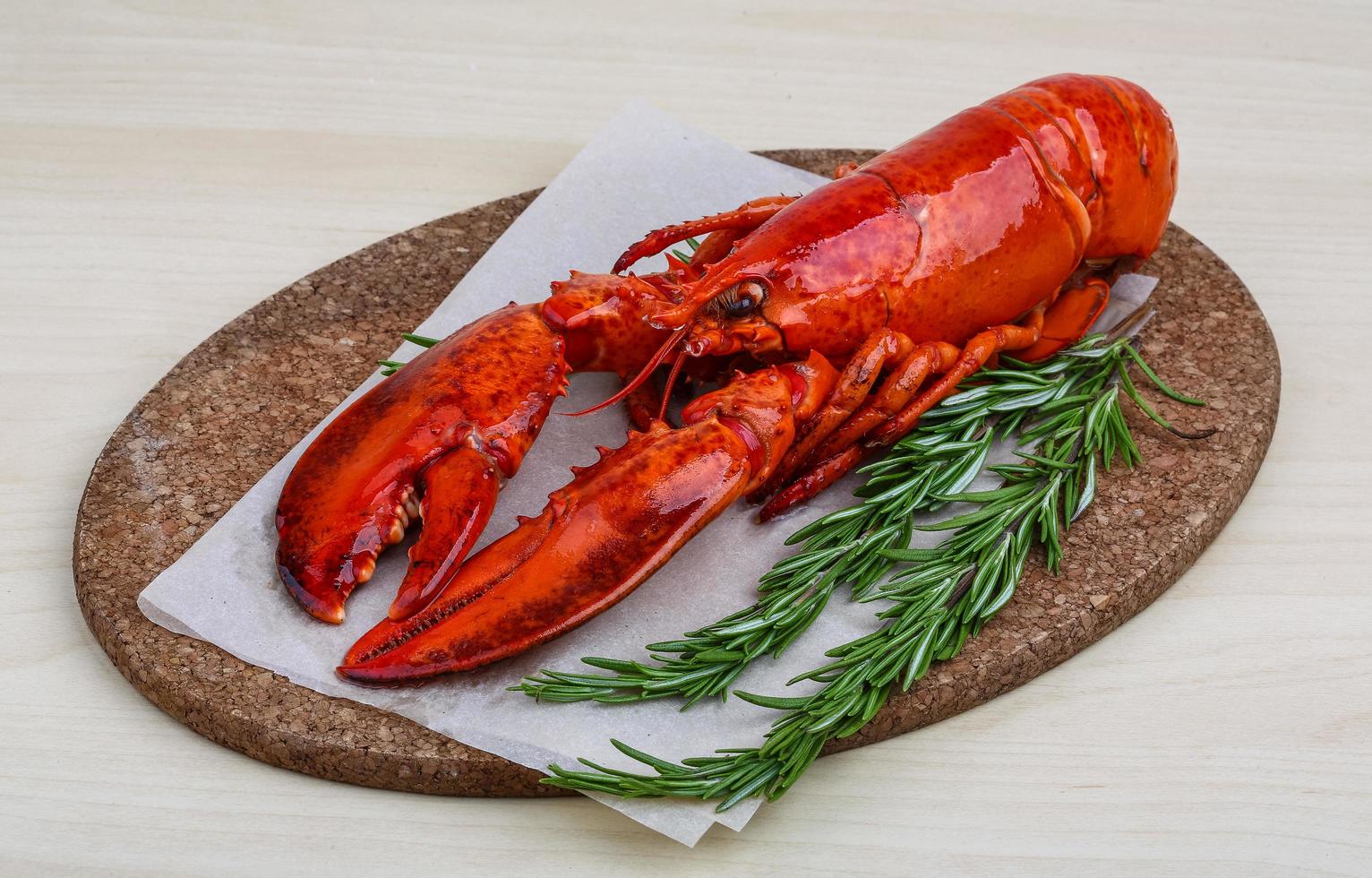 Lobster on wooden board and wooden background photo