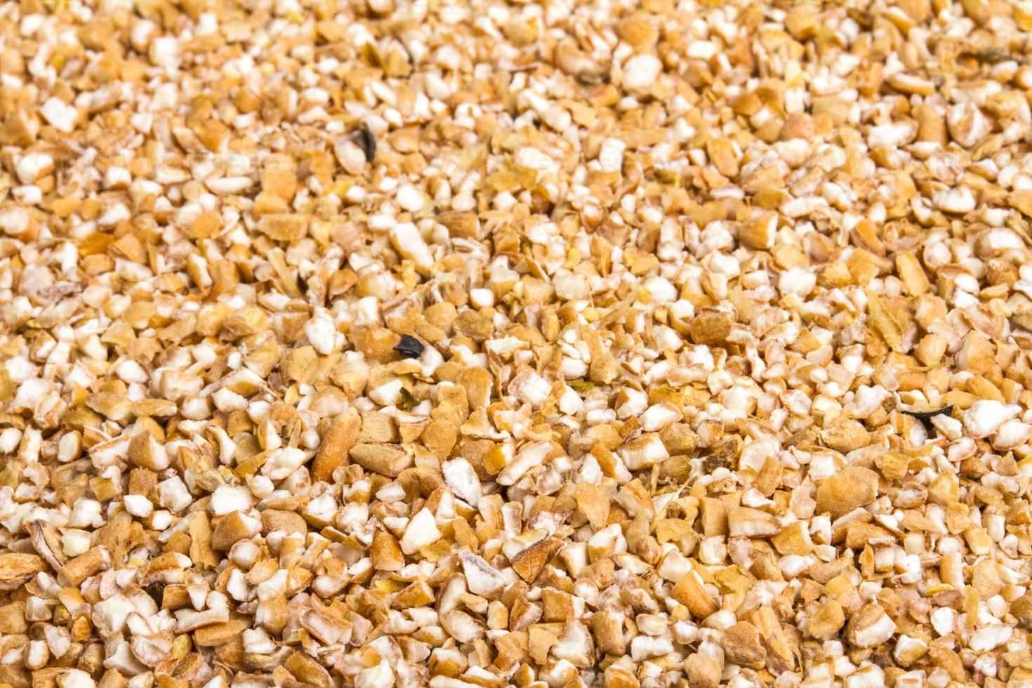 Pearl barley heap isolated on white photo