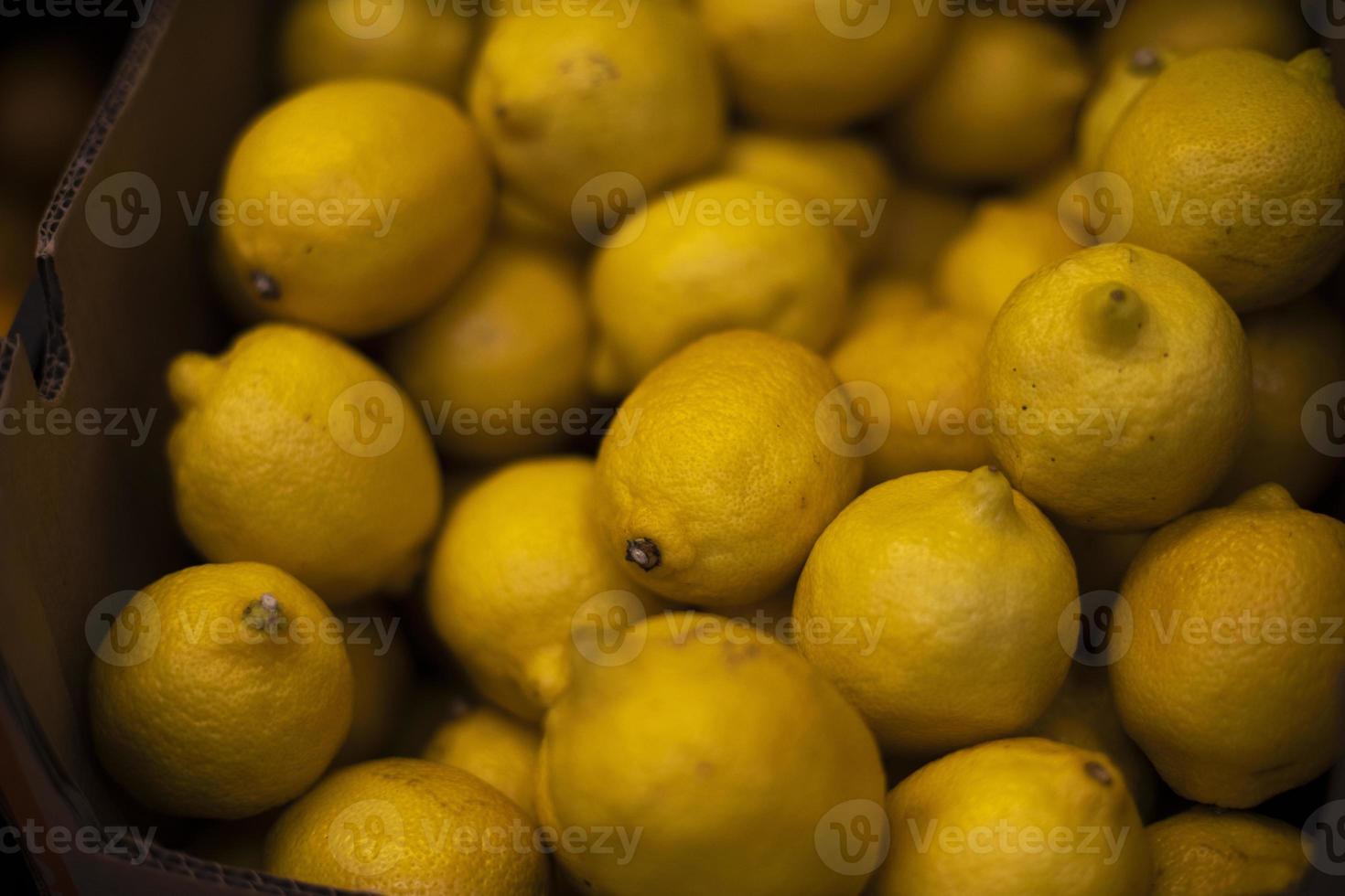 Lemon in drawer. Lots of lemons on market. Vitamin C in fruit. 12271207