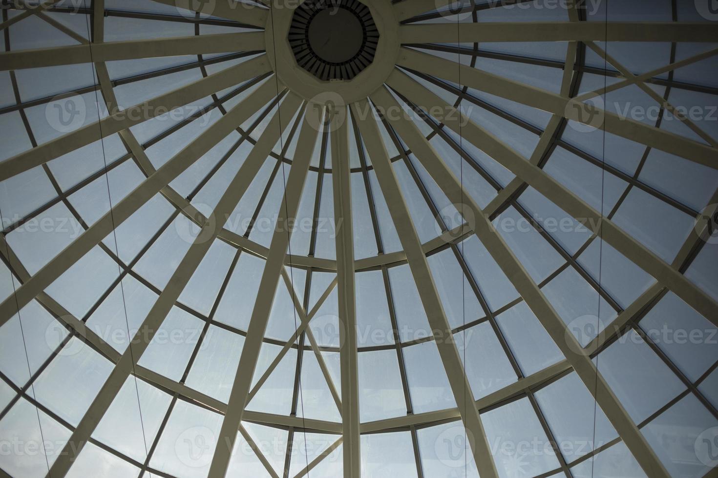 Dome roof made of glass and fittings. Steel beams form circle. photo
