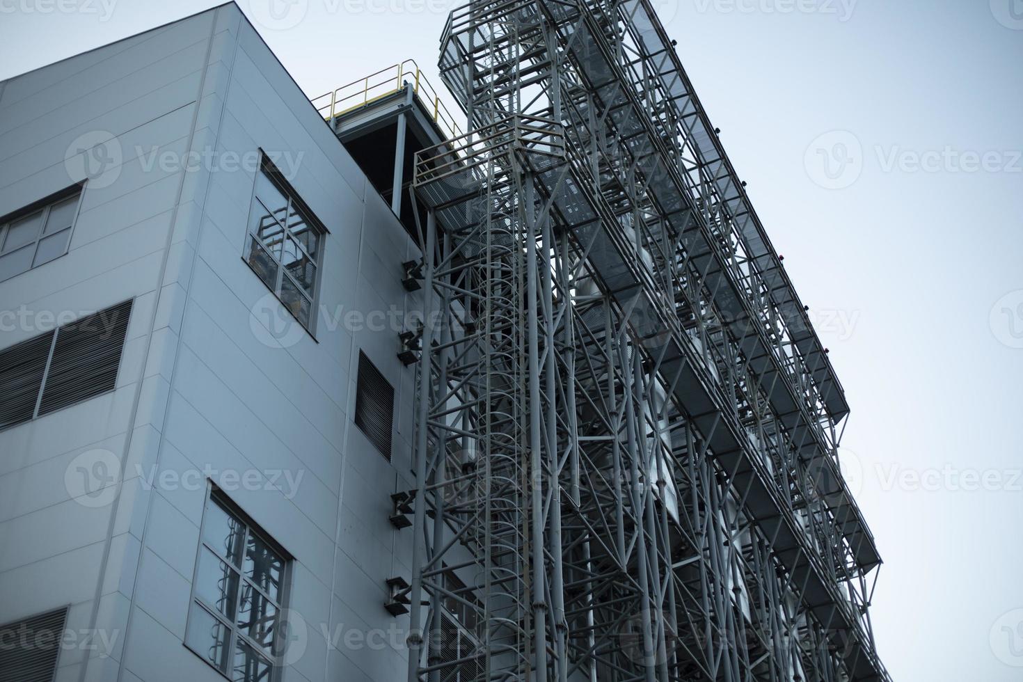 Industrial facility. Production building. Technical structure. Steel work. photo