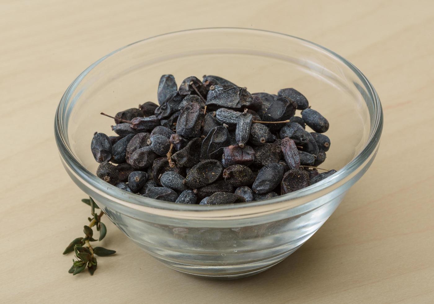 Barberries in a bowl on wooden background photo