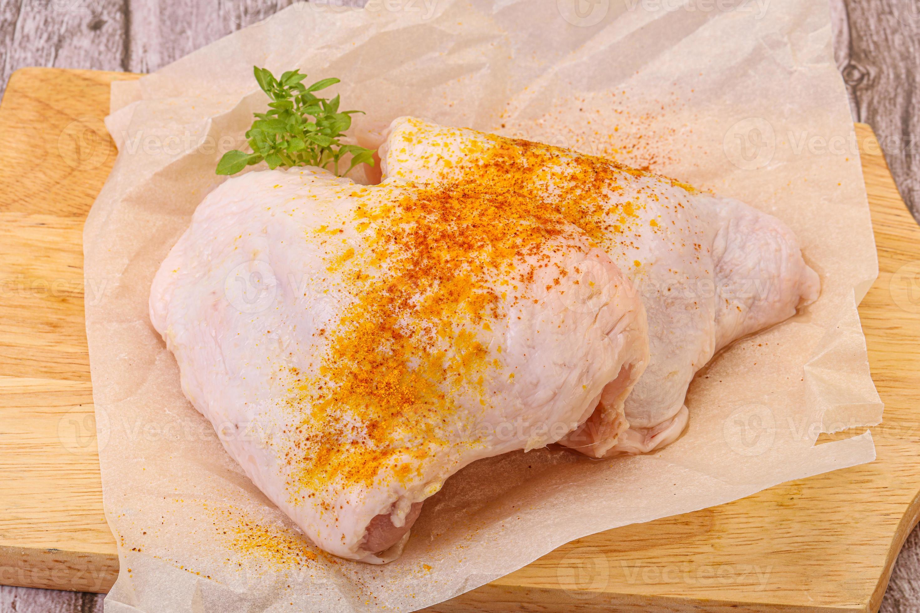 Raw chicken thigh with spices 12272515 Stock Photo at Vecteezy