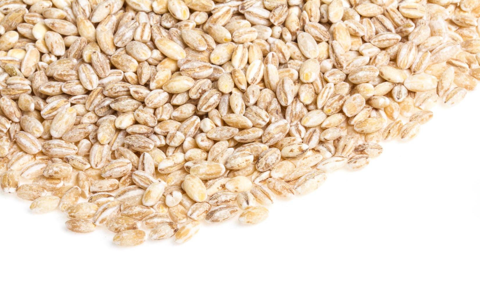 Pile of Pearl Barley isolated on white photo