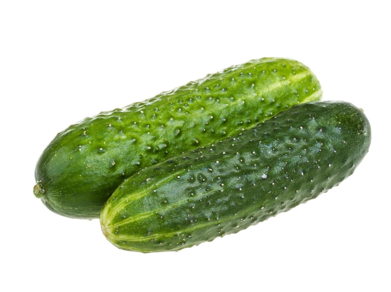 Healthy food. The green cucumbers isolated on white background photo