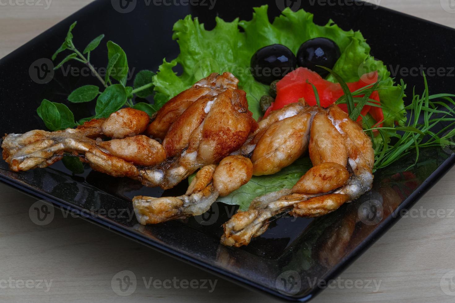 Roasted Frog legs photo