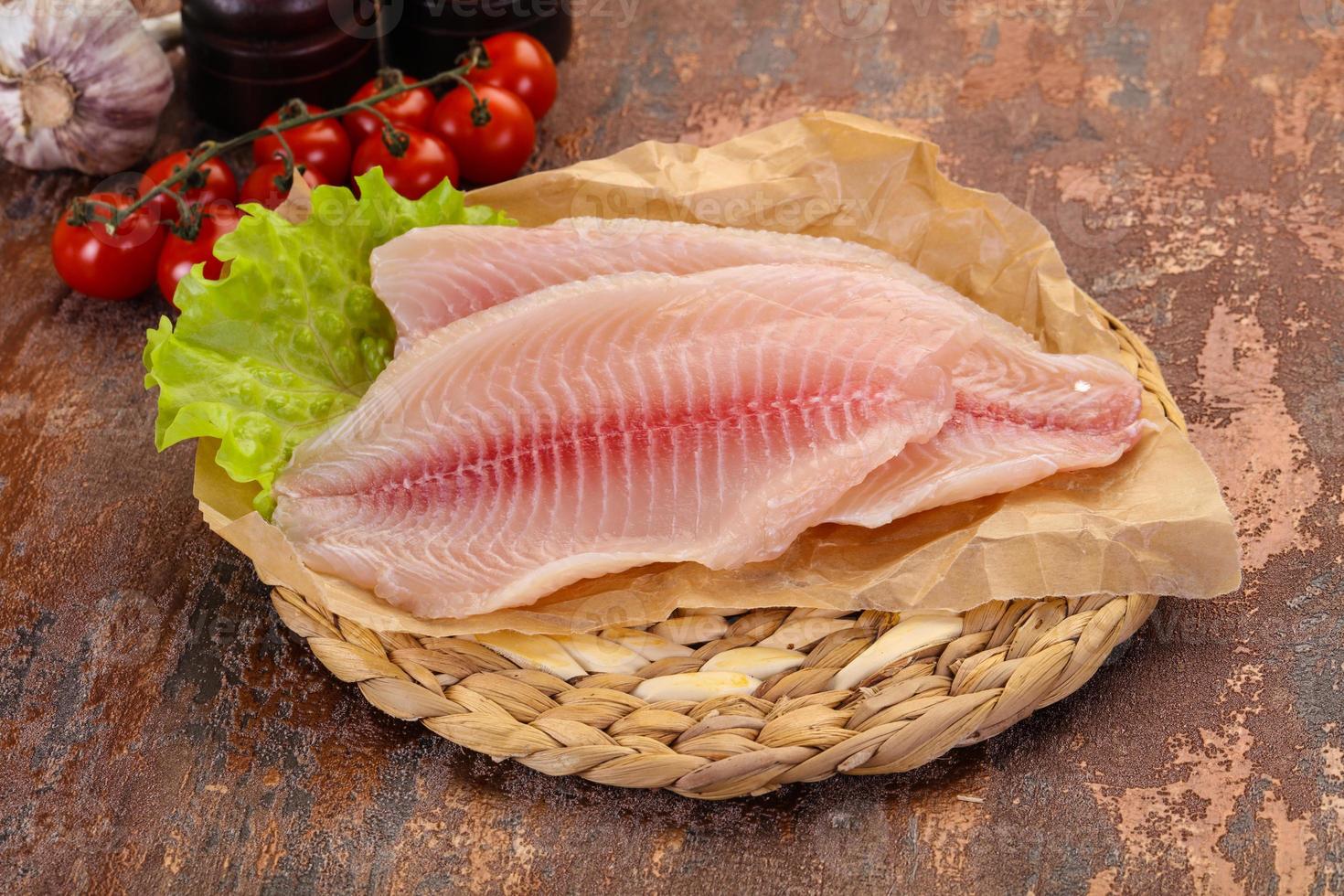 Raw tilapia fish 12274024 Stock Photo at Vecteezy