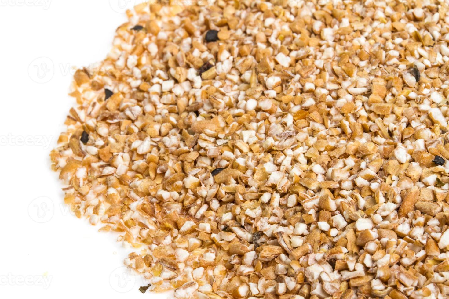 Pearl barley heap isolated on white photo