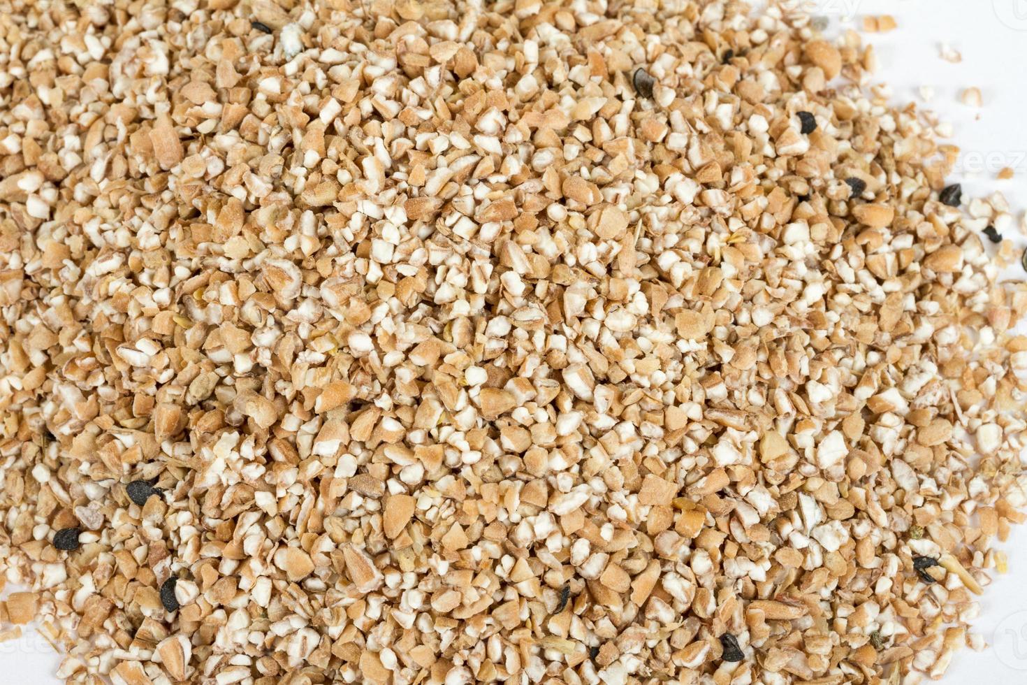 Pearl barley heap isolated on white photo