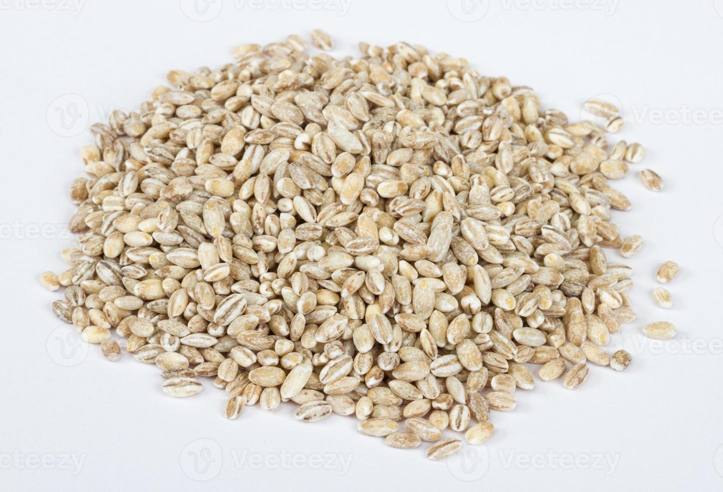 Pearl barley heap isolated on white photo