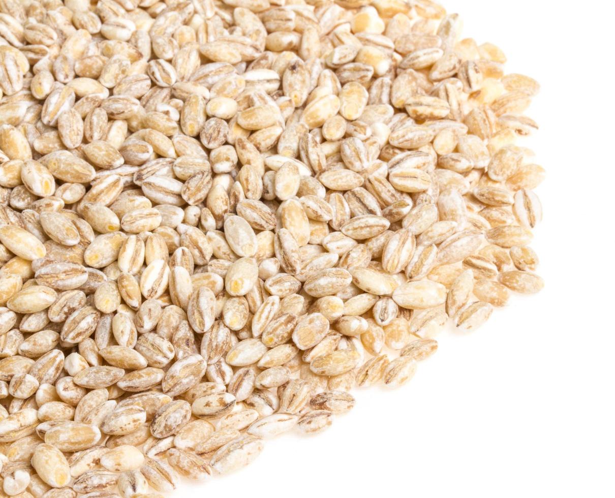 Pile of Pearl Barley isolated on white photo