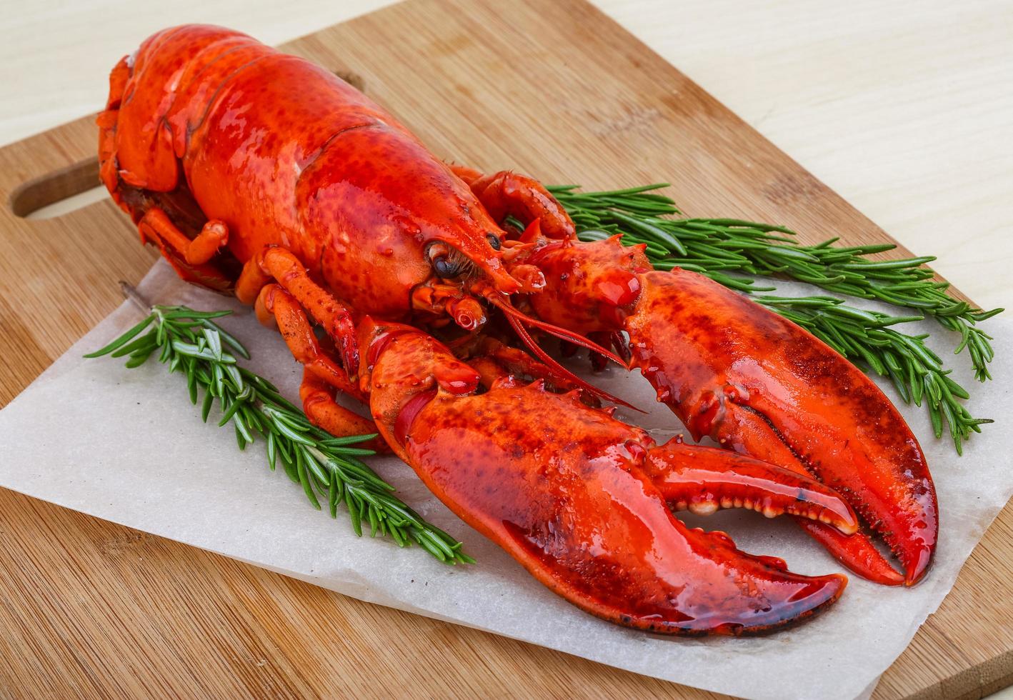 Lobster on wooden board and wooden background photo