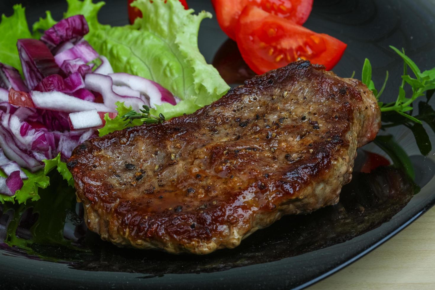 Beefsteak on the plate photo