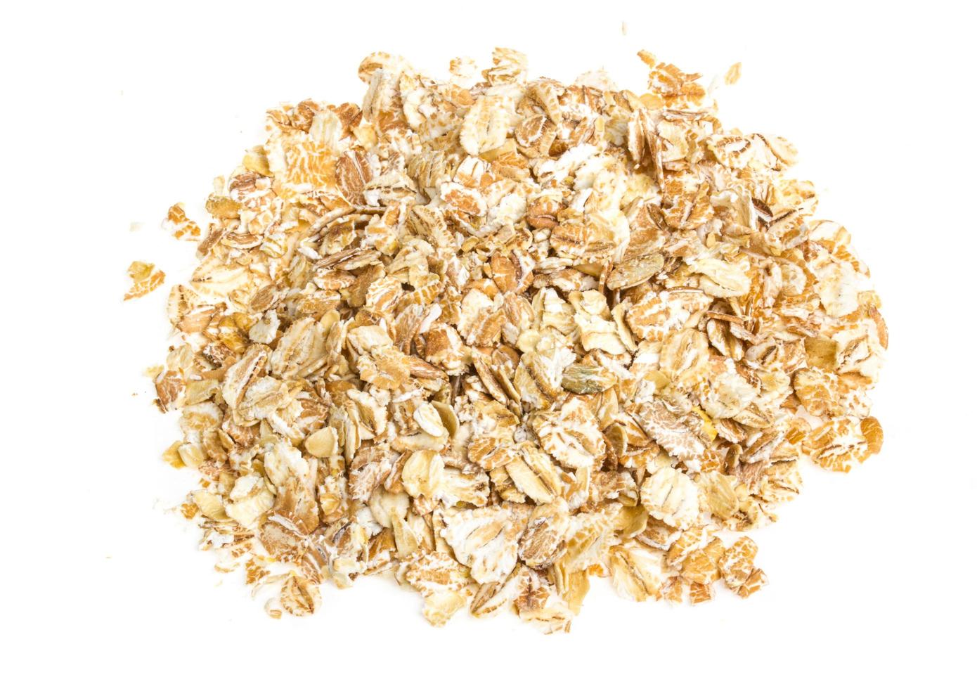 Heap of dry rolled oats isolated on white background 12276042 Stock