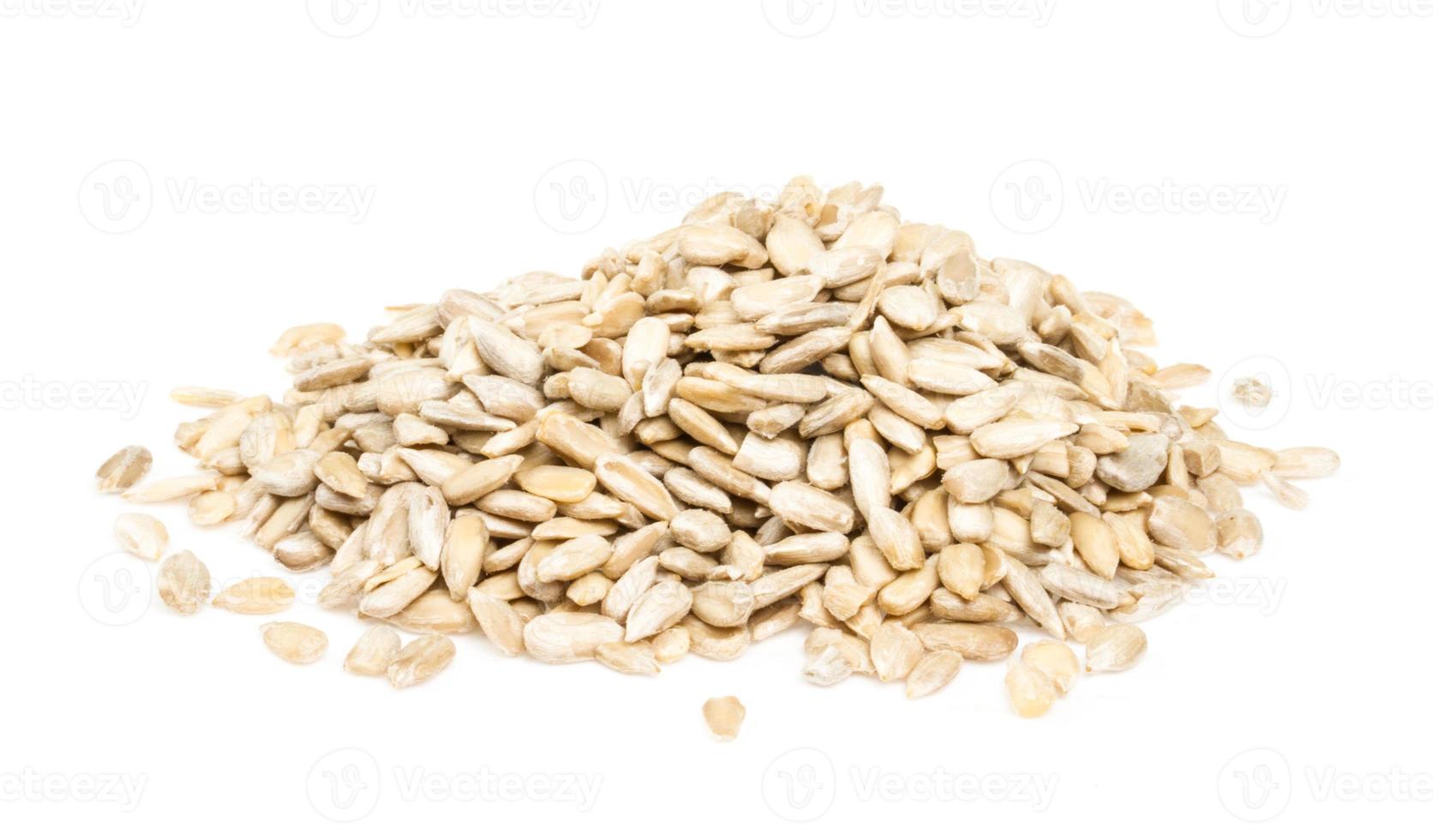 fresh sunflower seeds isolated on a white background photo