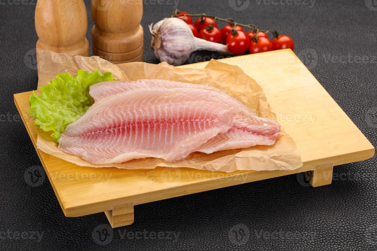 Raw tilapia fish 12276775 Stock Photo at Vecteezy