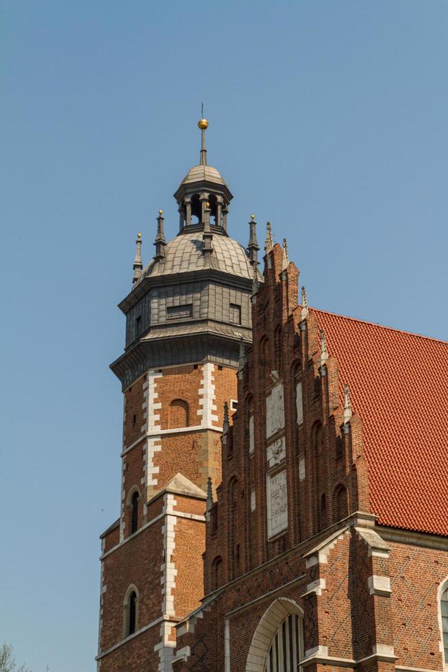 Cracow - Corpus Christi Church was founded by Kasimirus III The Great about 1340. The front elevation has a gothic gable whilst decoration of the interior is baroque photo