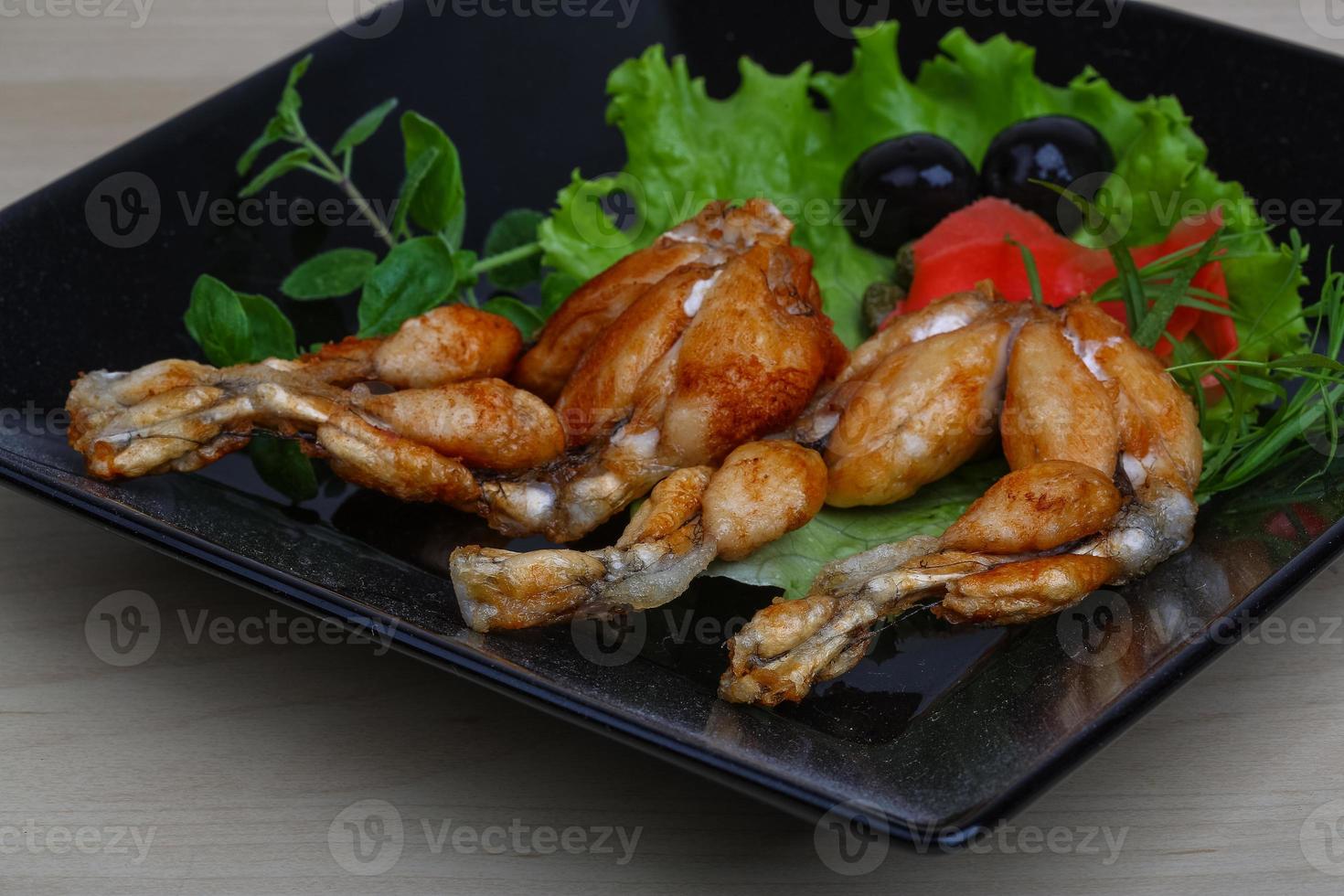 Roasted Frog legs photo