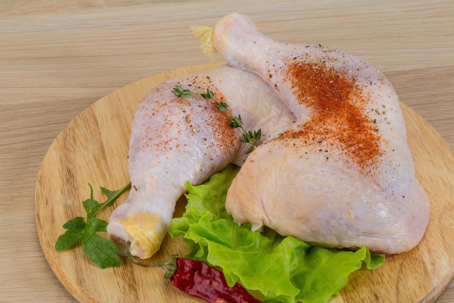 Raw chicken leg photo