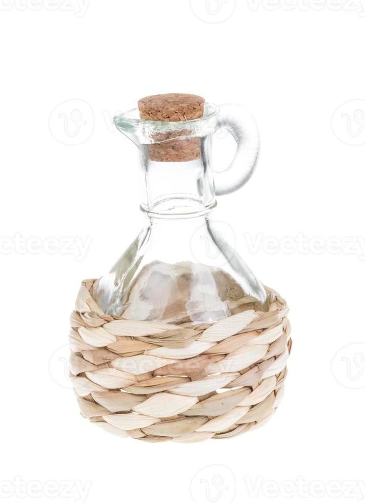 straw-rapped bottle isolated on white photo