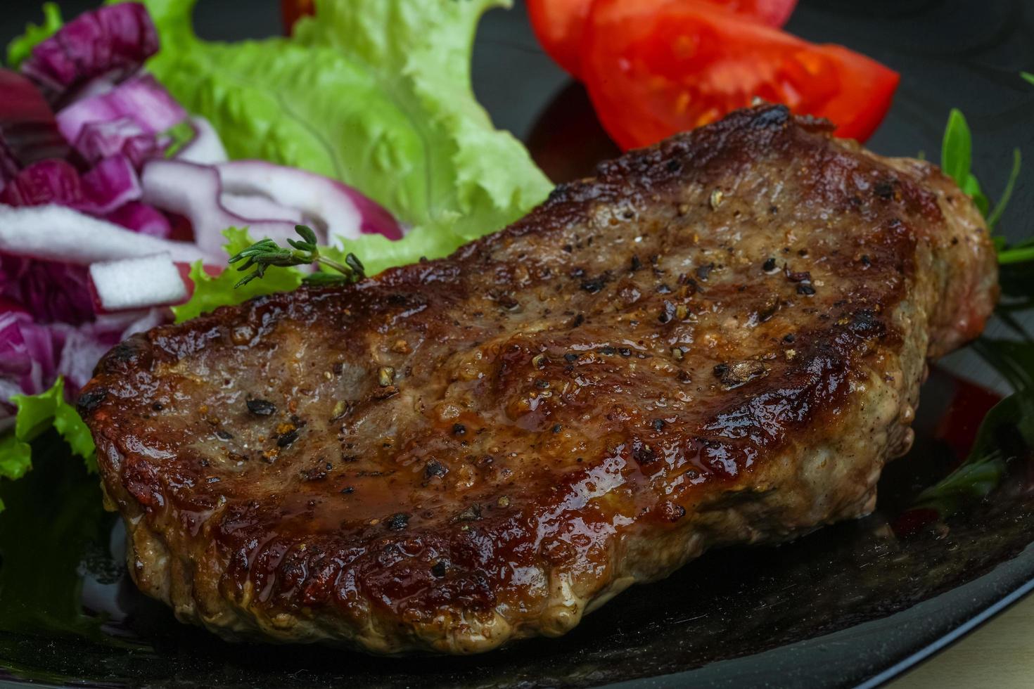 Beefsteak on the plate photo