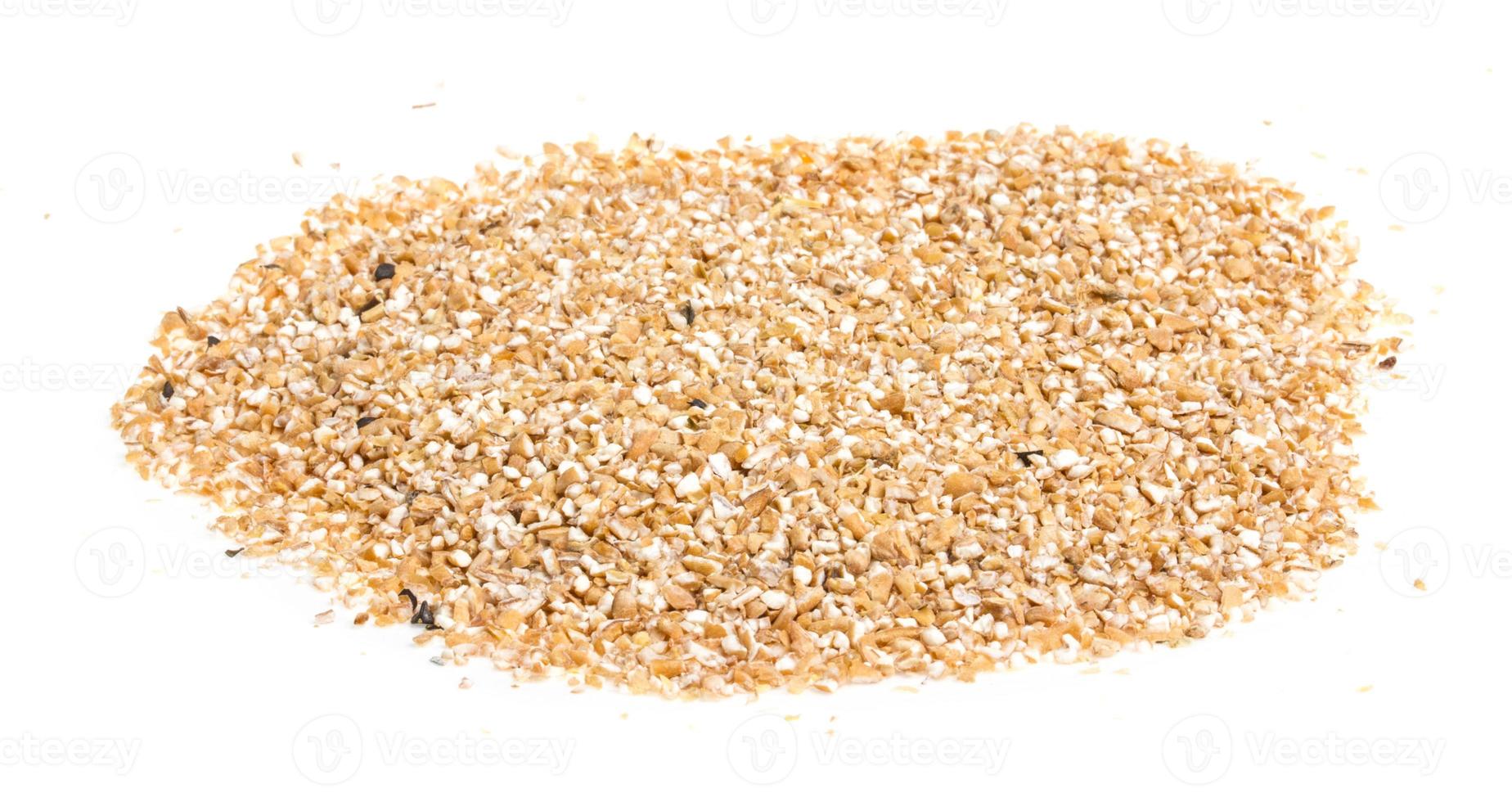 Pearl barley heap isolated on white photo