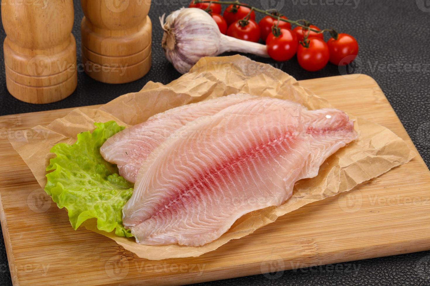 Raw tilapia fish 12280840 Stock Photo at Vecteezy