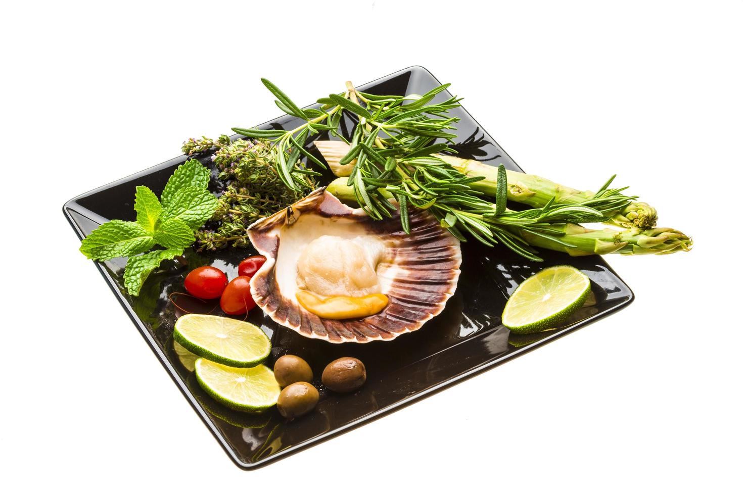 Scallop with asparagus, lime, mint and rosemary photo