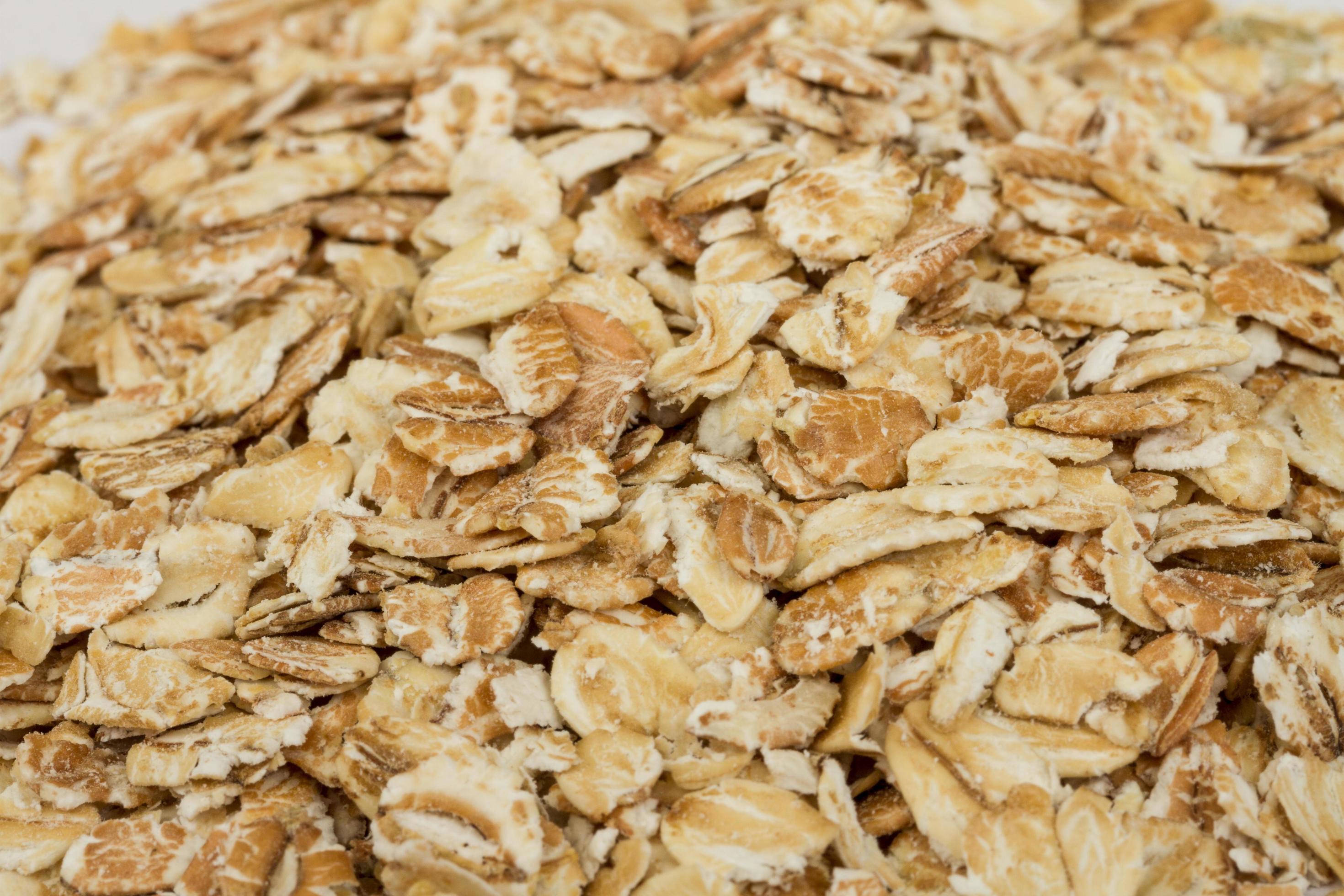 Heap of dry rolled oats isolated on white background 12281586 Stock