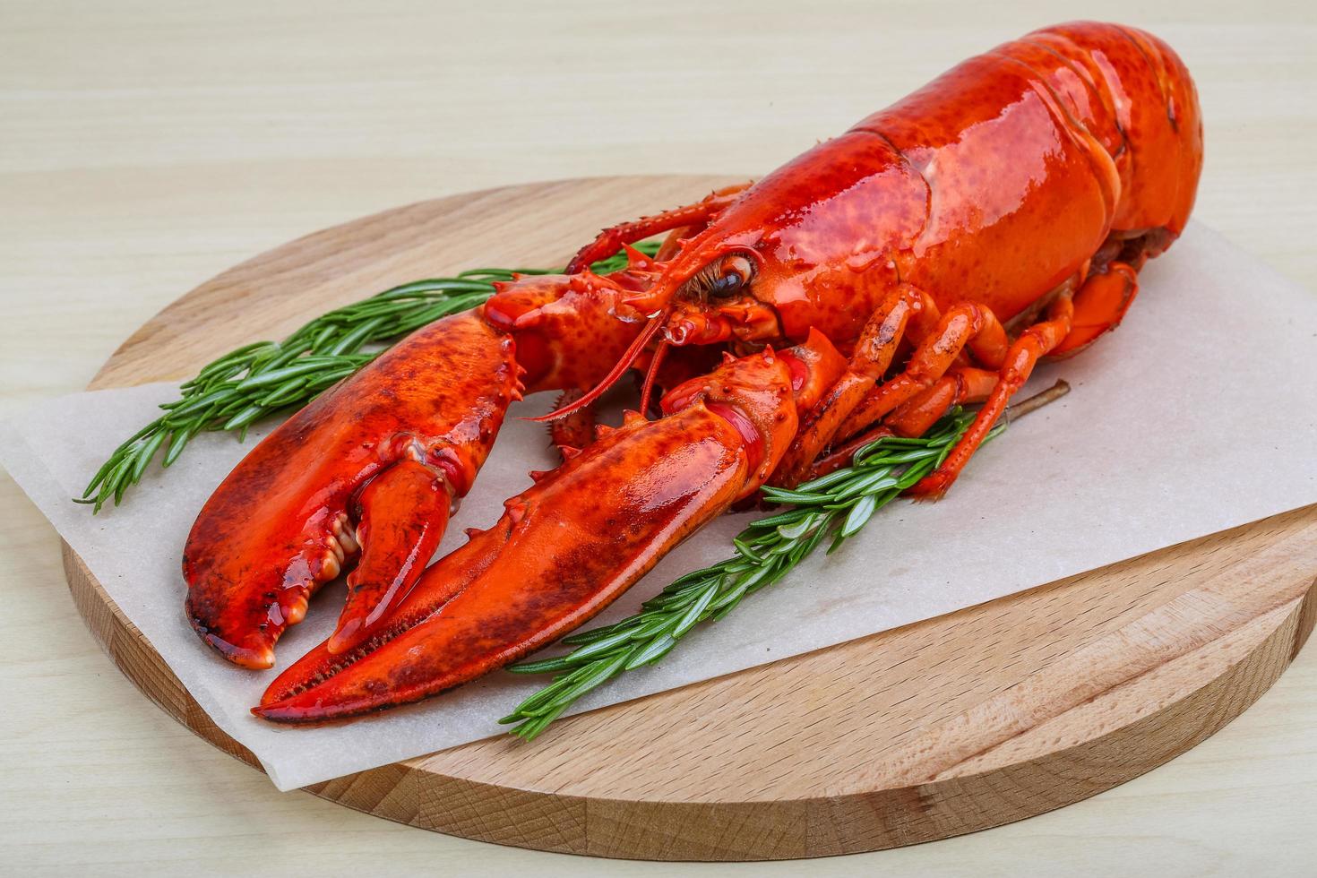 Lobster on wooden board and wooden background photo