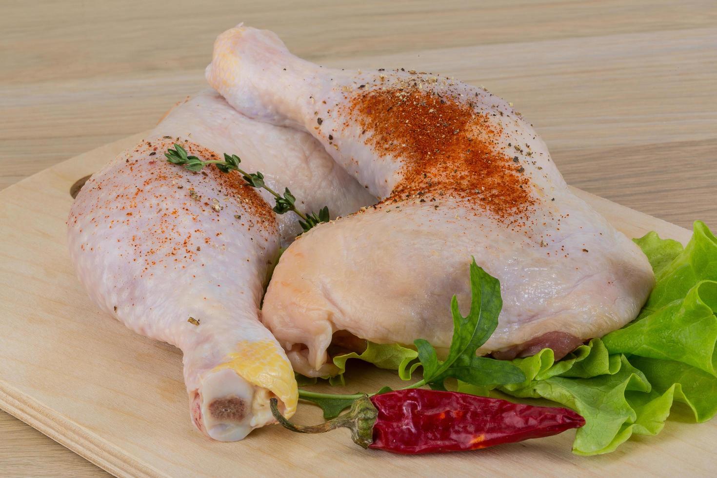 Raw chicken leg photo