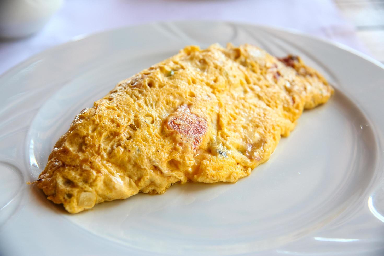 Omelet on the plate and white background photo