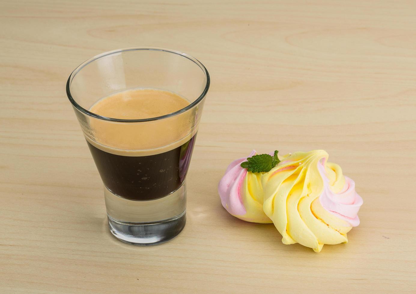 Meringue on wooden background photo