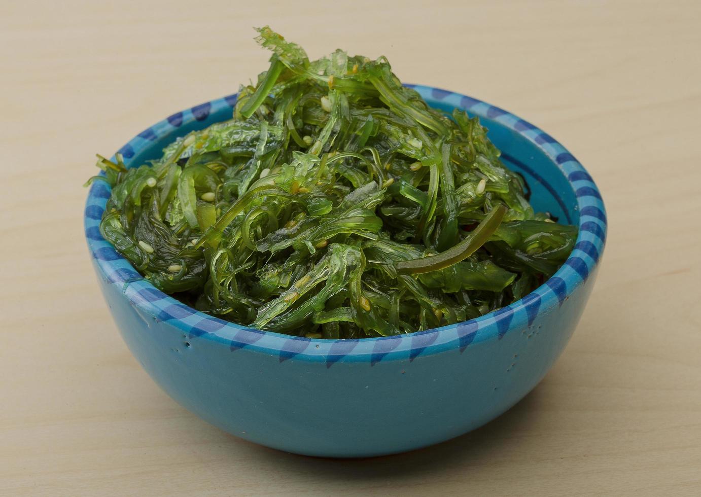 Chuka salad in a bowl on wooden background photo