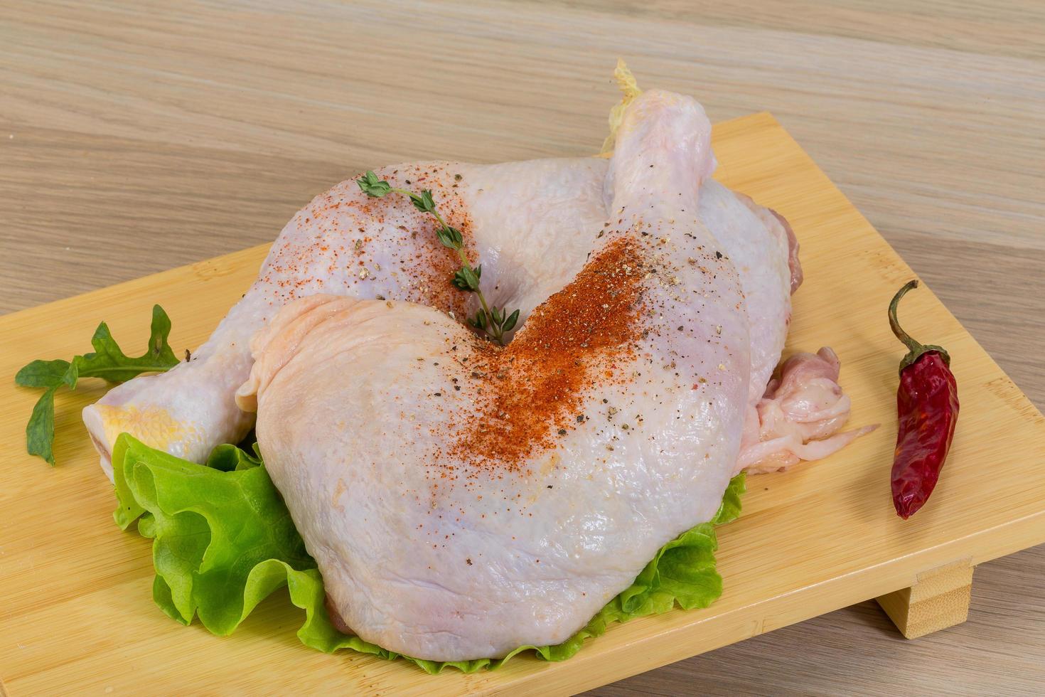 Raw chicken leg photo