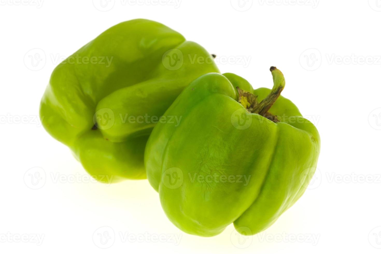 Two Green bell pepper isolated on white photo