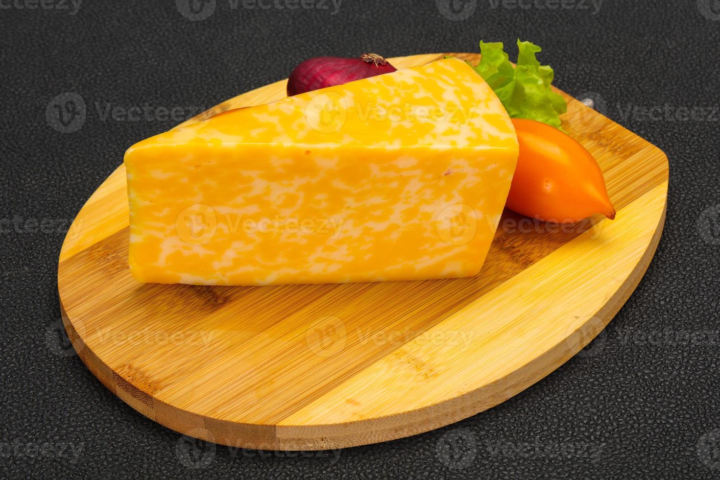 Marble cheese triangle over wooden 12284813 Stock Photo at Vecteezy