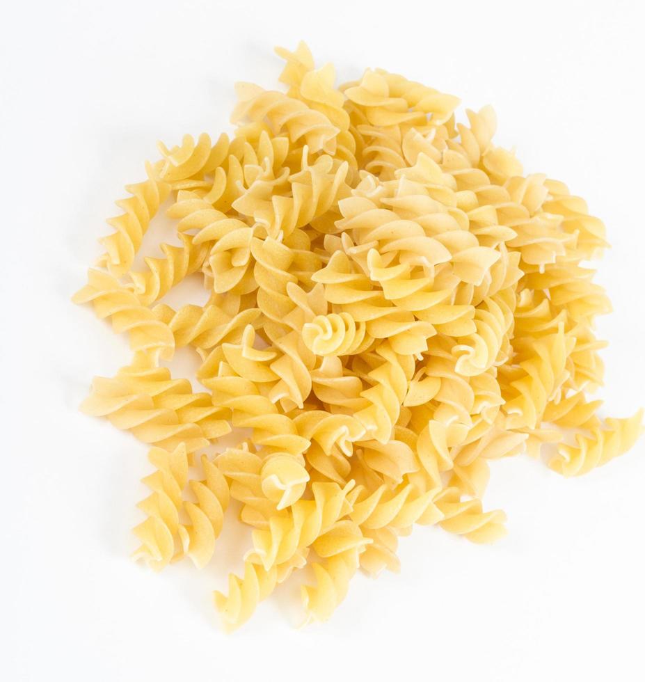 A portion of Rotini corkscrew pasta isolated on white. photo