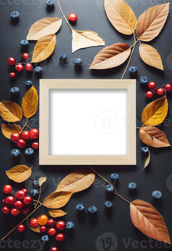 Autumn theme photo frame mock up picture surrounded by leaves and berries