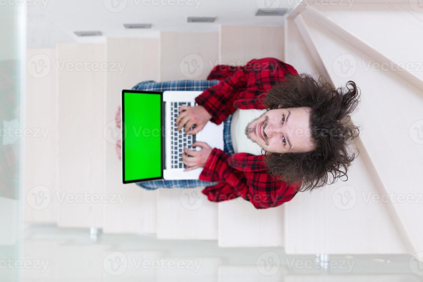 freelancer in bathrobe working from home photo