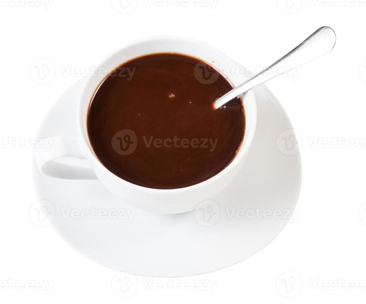 carob powder drink in white cup with spoon photo